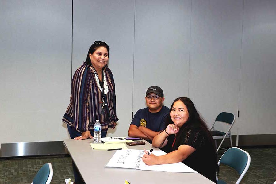 Two SJC students who are enrolled in the TeachUp Academy are meeting with a Western New Mexico Advisor